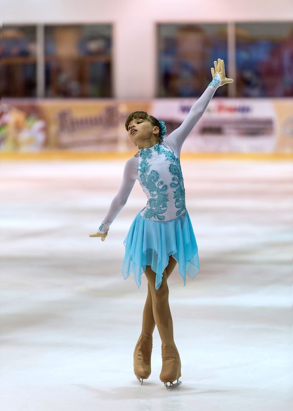 Girl competing at a figure skating competition